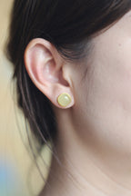 GALET 020 · Golden Green — nephrite jade earrings, on the model