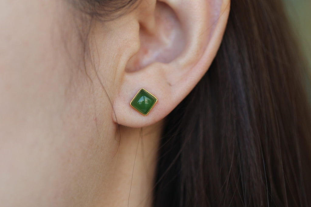 GALET 022 · Spinach Green — nephrite jade earrings, on the model