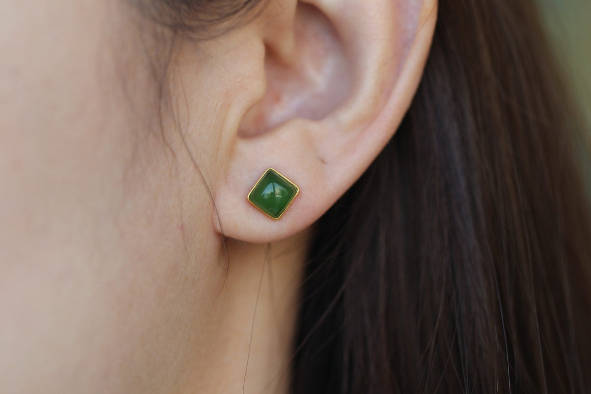 GALET 022 · Spinach Green — nephrite jade earrings, on the model