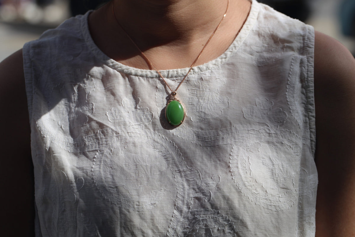 GALET 027 · Willow Green — nephrite jade pendant, on the model