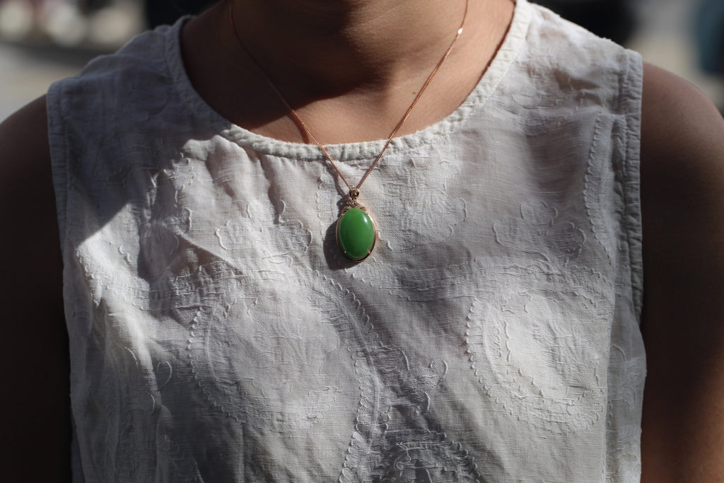 GALET 027 · Willow Green — nephrite jade pendant, on the model, close