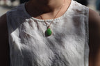 GALET 027 · Willow Green — nephrite jade pendant, on the model, close