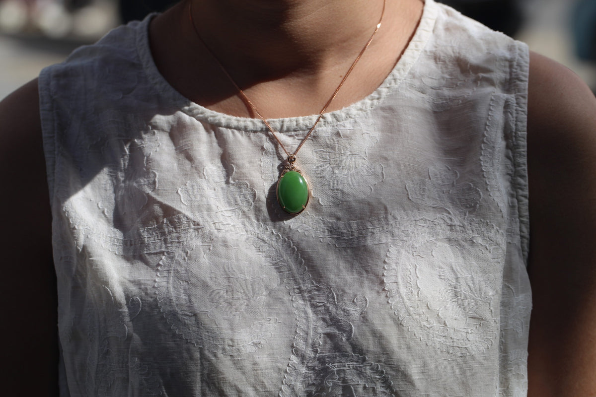 GALET 027 · Willow Green — nephrite jade pendant, on the model, close