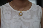 GALET 029 · Suet White — nephrite jade pendant, on the model