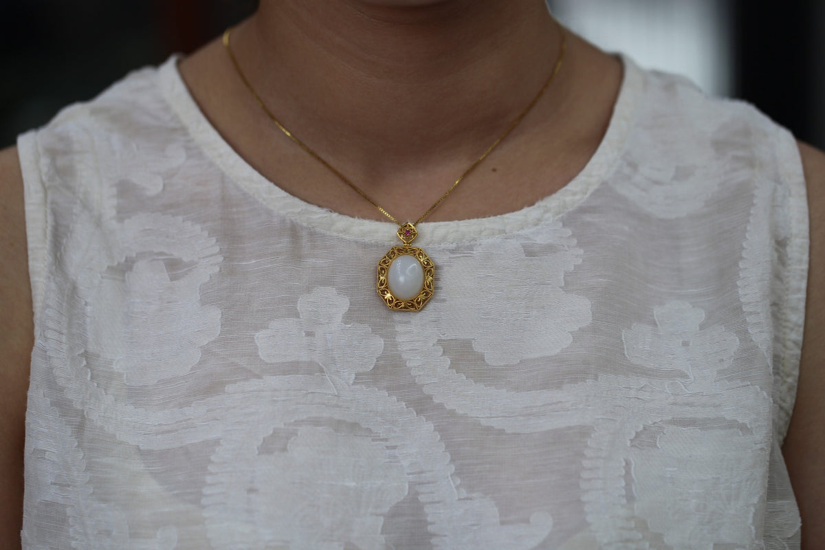 GALET 029 · Suet White — nephrite jade pendant, on the model, close