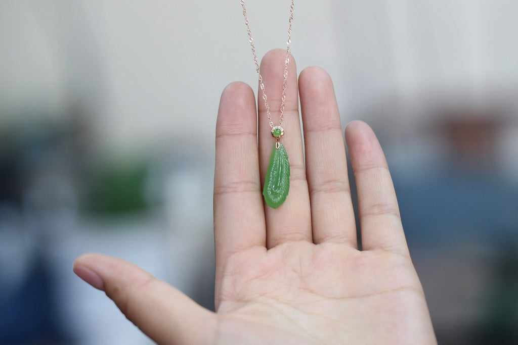 GALET 033 · Willow Green — nephrite jade pendant, in the hand