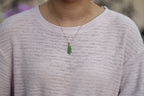 GALET 033 · Willow Green — nephrite jade pendant, on the model, close