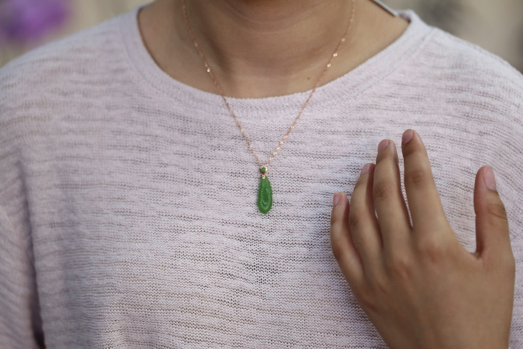 GALET 033 · Willow Green — nephrite jade pendant, on the model