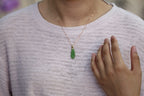GALET 033 · Willow Green — nephrite jade pendant, on the model