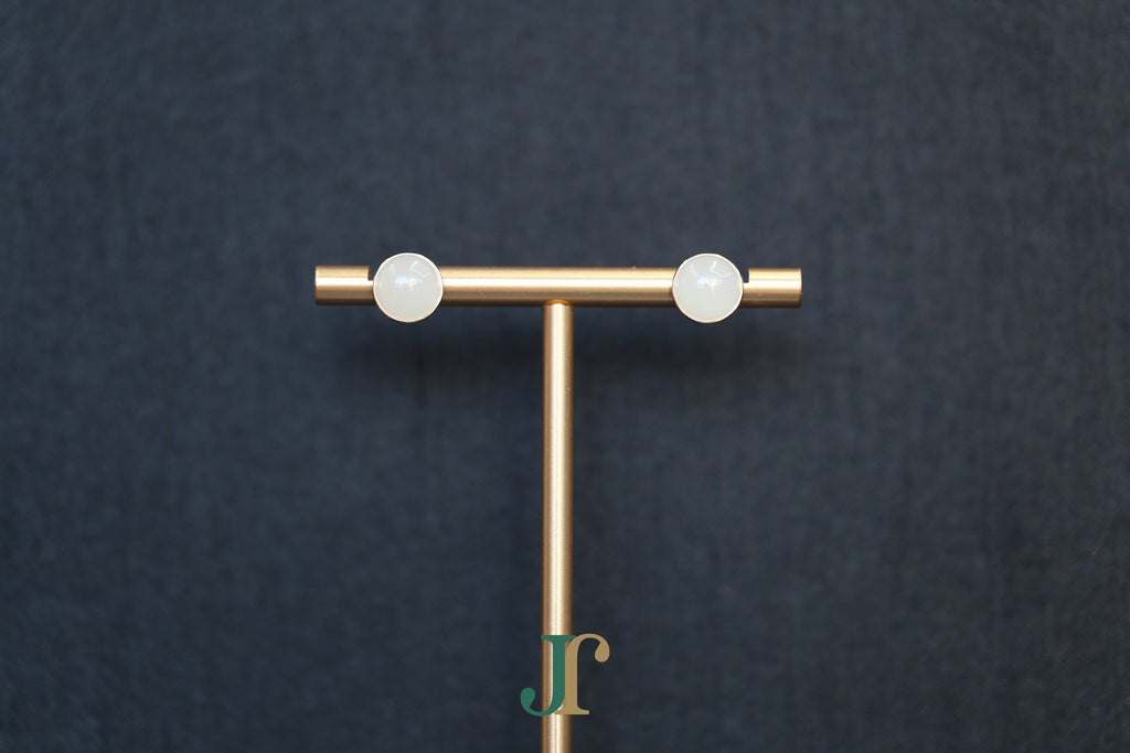 GALET 034 · Suet White — nephrite jade earrings, on a display stand