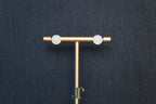 GALET 034 · Suet White — nephrite jade earrings, on a display stand