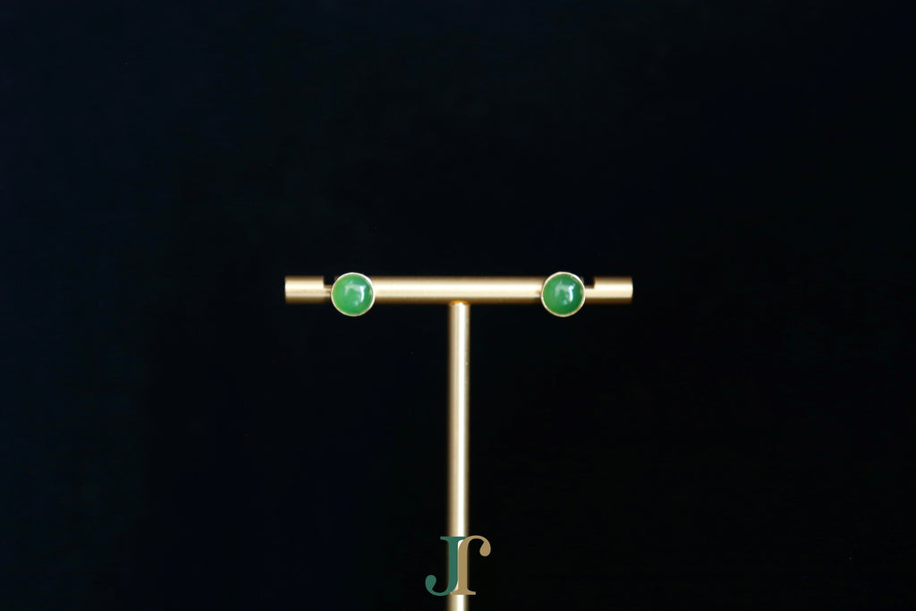 GALET 035 · Willow Green — nephrite jade earrings, on a display stand