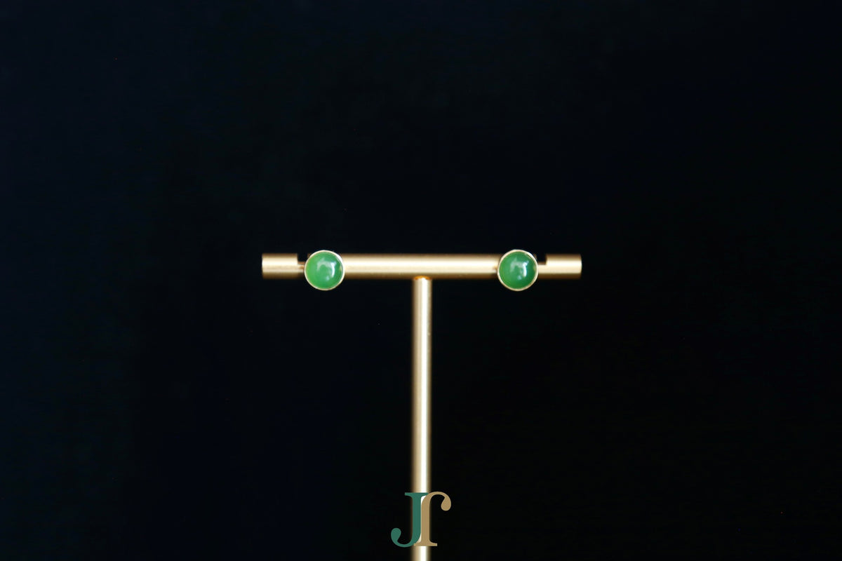 GALET 035 · Willow Green — nephrite jade earrings, on a display stand