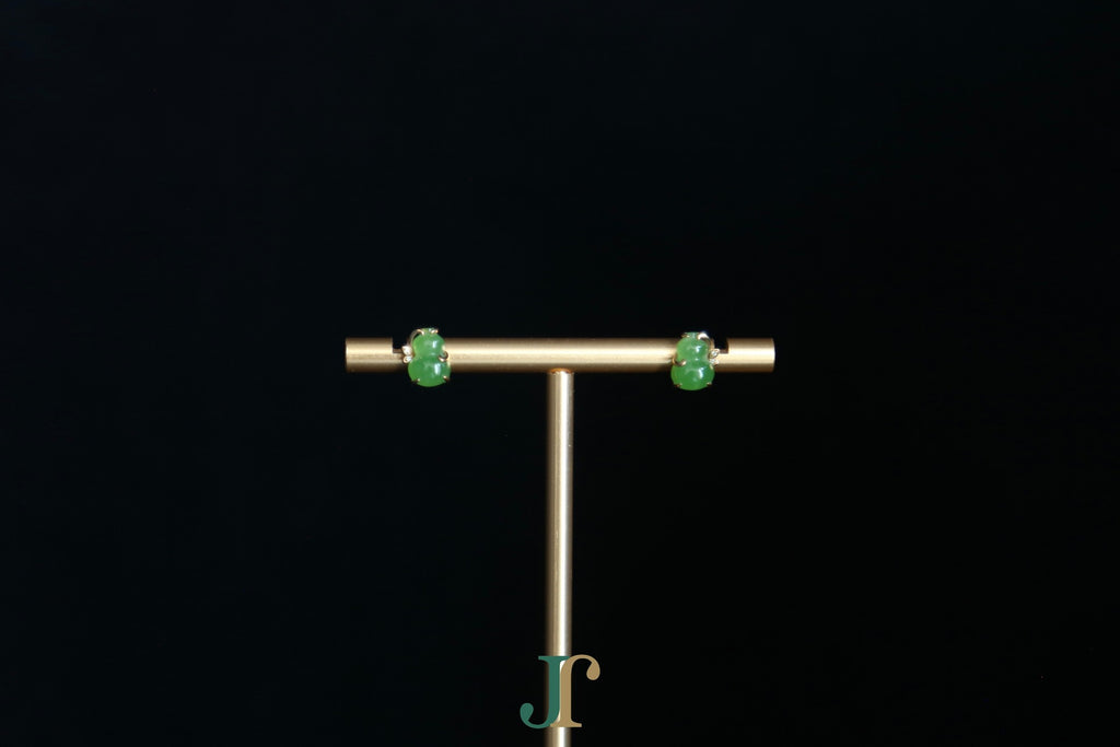 GALET 036 · Willow Green — nephrite jade earrings, on a display stand