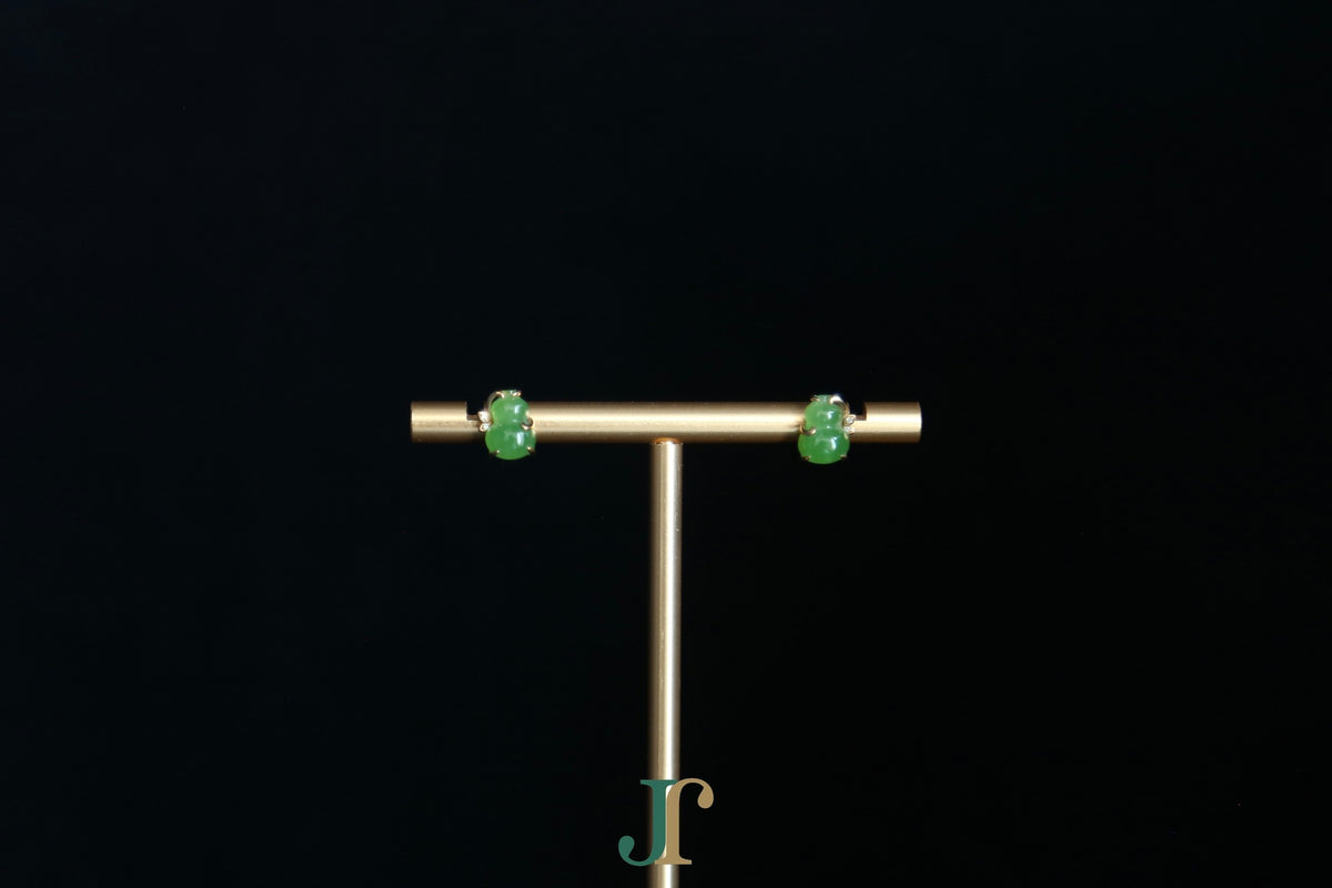 GALET 036 · Willow Green — nephrite jade earrings, on a display stand