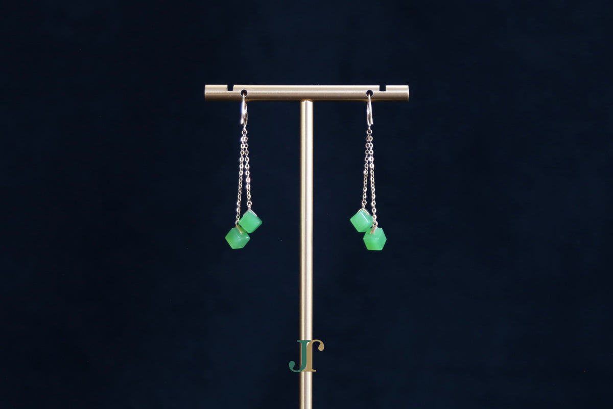 GALET 038 · Willow Green — nephrite jade earrings, on a display stand