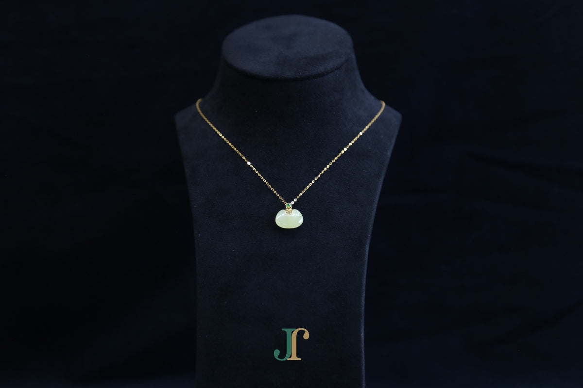 GALET 039 · Golden Green — nephrite jade necklace, on a display bust