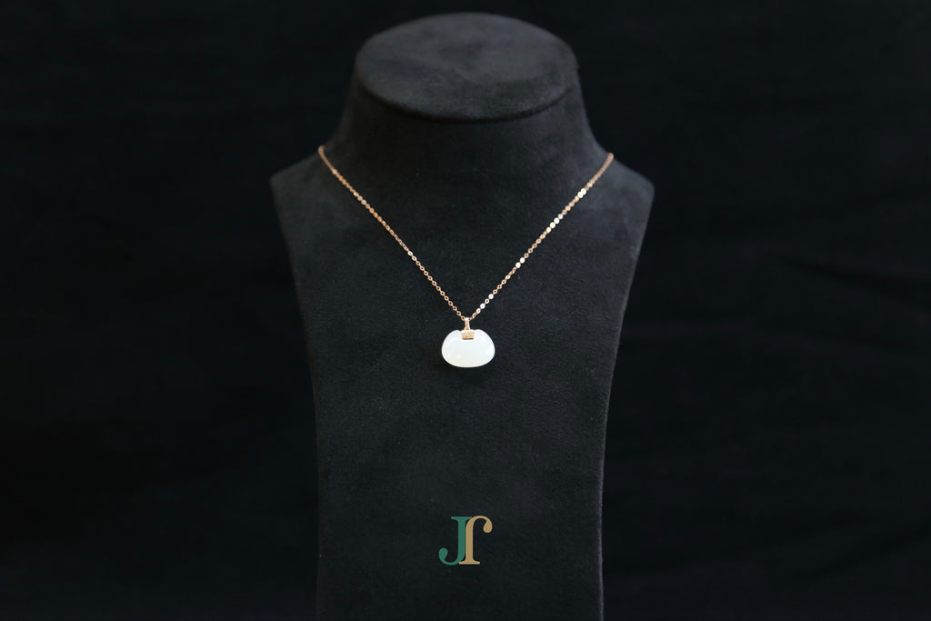 GALET 040 · Suet White — nephrite jade necklace, on a display bust
