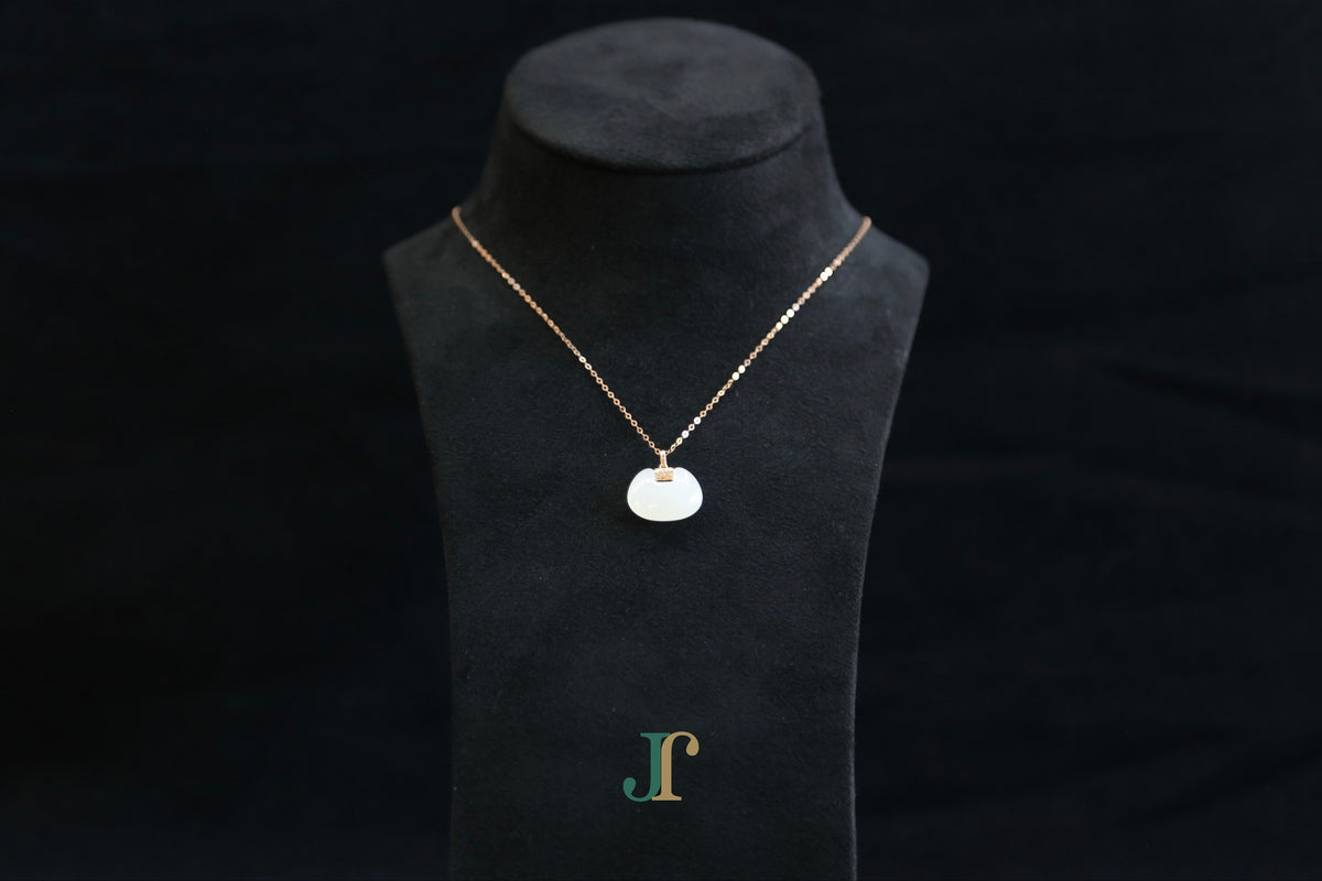 GALET 040 · Suet White — nephrite jade necklace, on a display bust