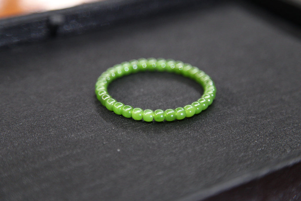 PILLAR Pill 6×5 · Spinach Green — nephrite jade cylinder bracelet, close view