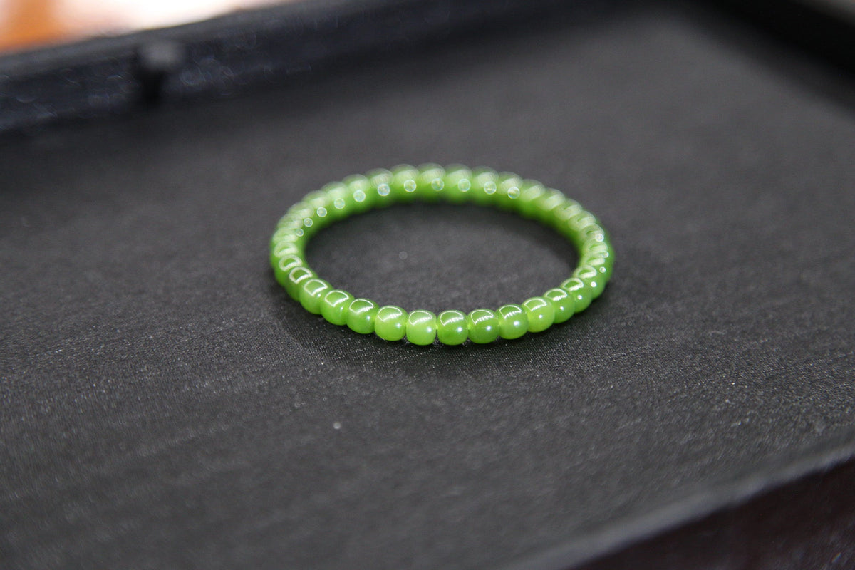 PILLAR Pill 6×5 · Spinach Green — nephrite jade cylinder bracelet, close view