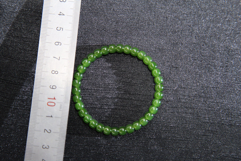 PILLAR Pill 6×5 · Spinach Green — nephrite jade cylinder bracelet, size reference