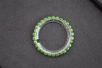 PILLAR Pill 7×6 · Willow Green — nephrite jade cylinder bracelet, on the model
