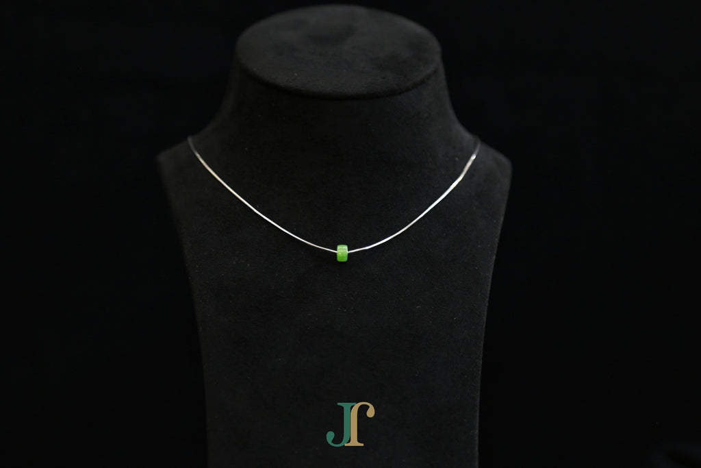 PASTILLE Pure 6×3 · Willow Green — nephrite jade pastille necklace, on a display bust