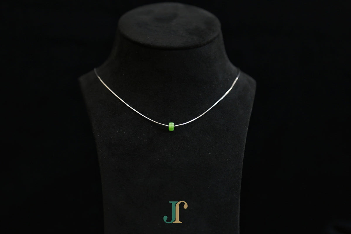 PASTILLE Pure 6×3 · Willow Green — nephrite jade pastille necklace, on a display bust