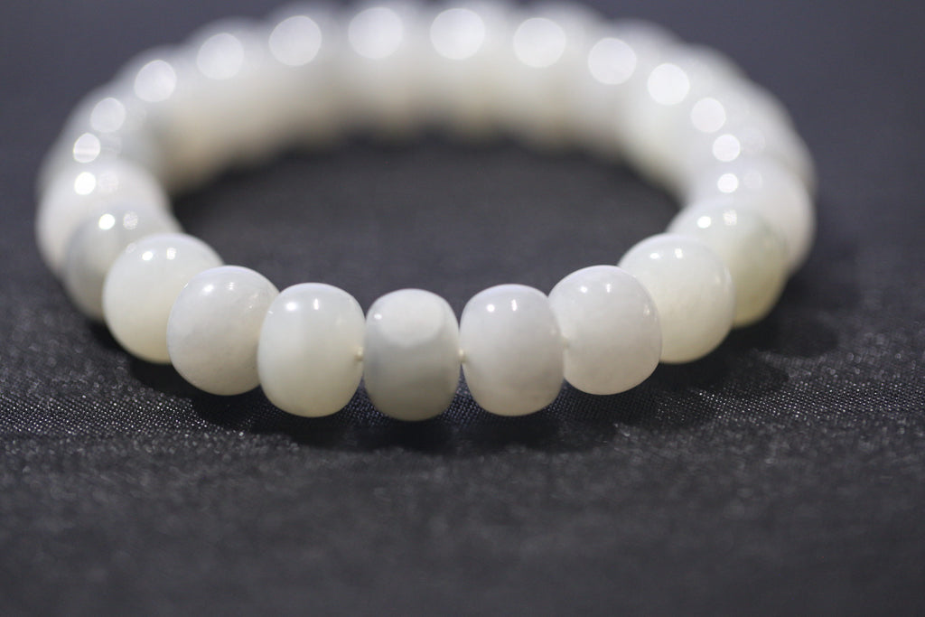 PILLAR Pill 12×9 · Ink Wash — nephrite jade cylinder bracelet, on the hand