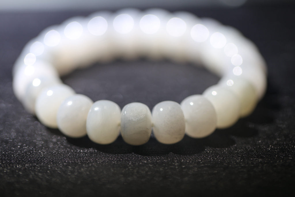 PILLAR Pill 12×9 · Ink Wash — nephrite jade cylinder bracelet, on the model