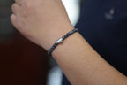 PILLAR Pill 6×5 · Ink Wash — nephrite jade cylinder bracelet, on the hand