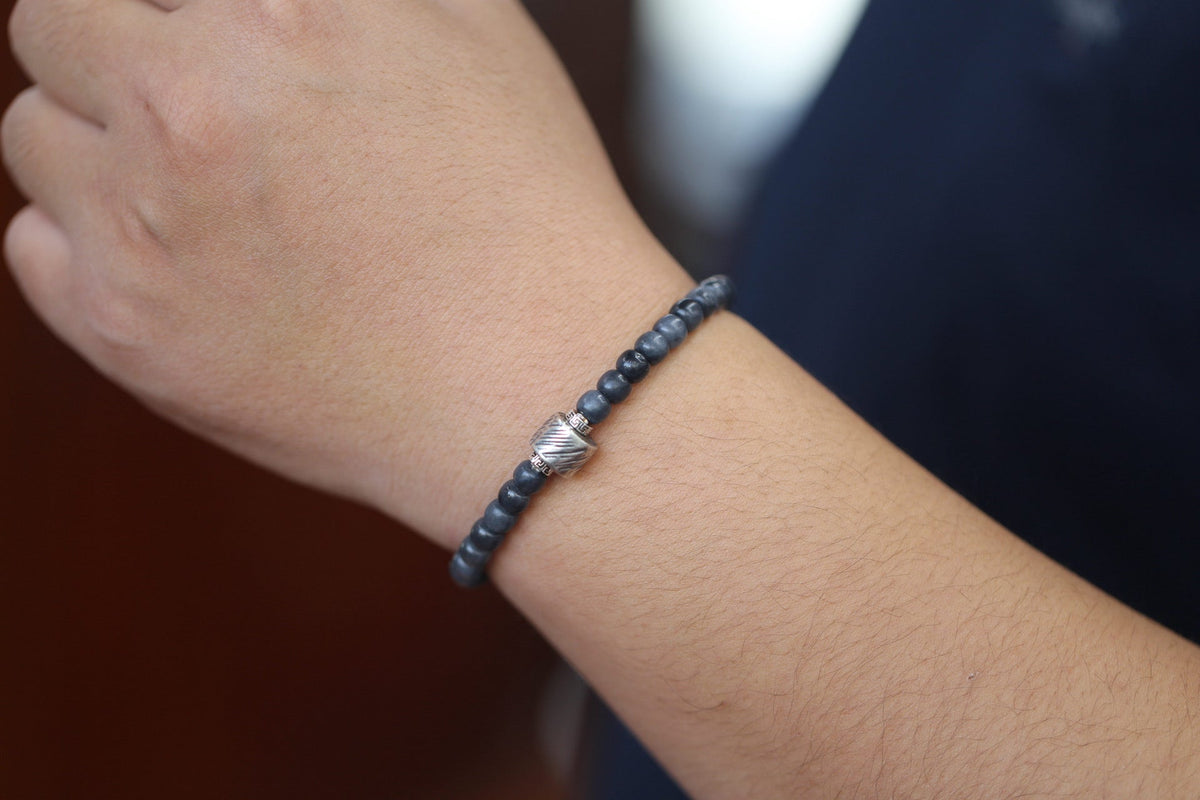PILLAR Pill 6×5 · Ink Wash — nephrite jade cylinder bracelet, on the model