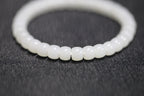 PILLAR Pill 6.7×5 · Suet White 1 — nephrite jade cylinder bracelet, detail