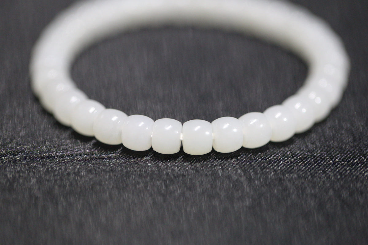 PILLAR Pill 6.7×5 · Suet White 1 — nephrite jade cylinder bracelet, detail