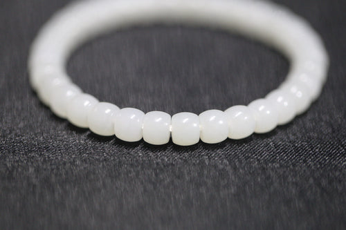 PILLAR Pill 6.7×5 · Suet White 1 — nephrite jade cylinder bracelet, detail