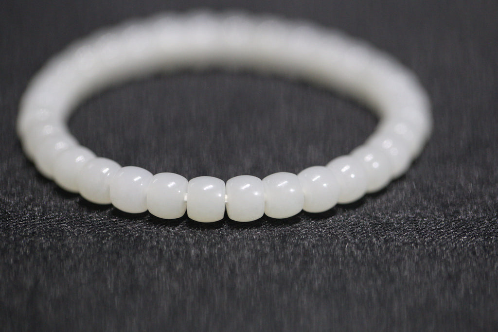 PILLAR Pill 6.7×5 · Suet White 1 — nephrite jade cylinder bracelet, close view