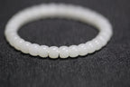PILLAR Pill 6.7×5 · Suet White 1 — nephrite jade cylinder bracelet, close view