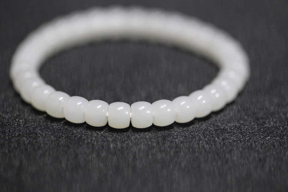 PILLAR Pill 6.7×5 · Suet White 1 — nephrite jade cylinder bracelet, close view