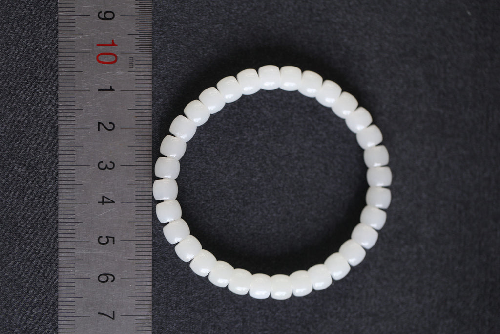 PILLAR Pill 6.7×5 · Suet White 1 — nephrite jade cylinder bracelet, size reference