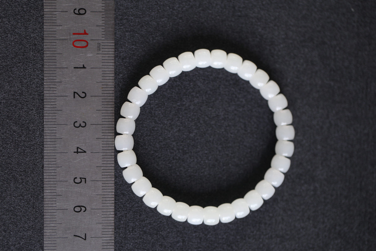 PILLAR Pill 6.7×5 · Suet White 1 — nephrite jade cylinder bracelet, size reference