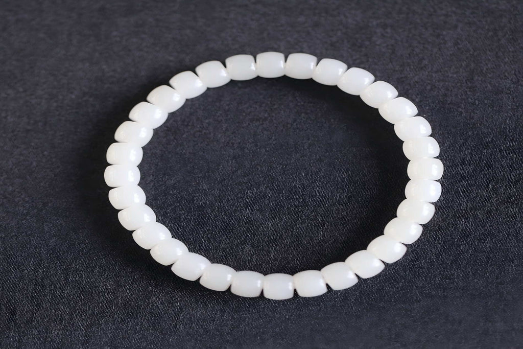 PILLAR Pill 6.7×5 · Suet White 1 — nephrite jade cylinder bracelet, front