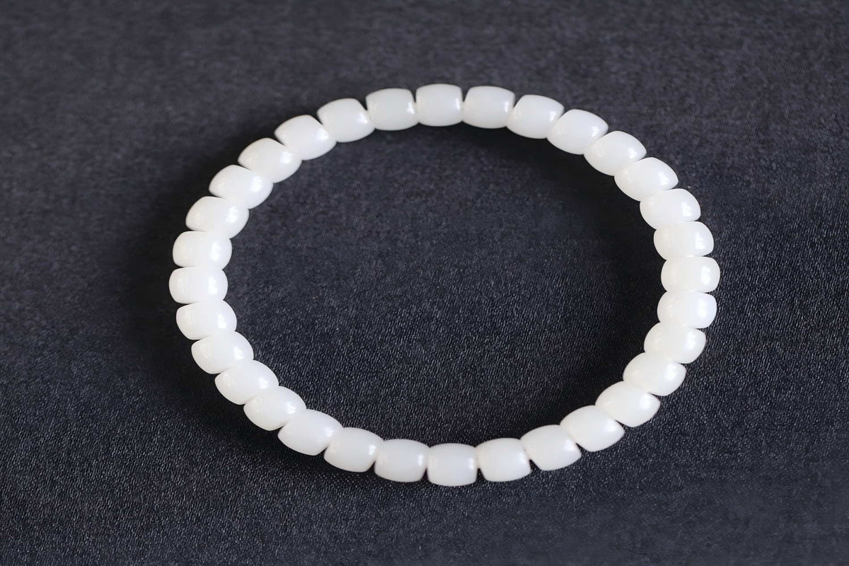 PILLAR Pill 6.7×5 · Suet White 1 — nephrite jade cylinder bracelet, front
