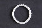 PILLAR Pill 6.7×5 · Suet White 1 — nephrite jade cylinder bracelet, on the model