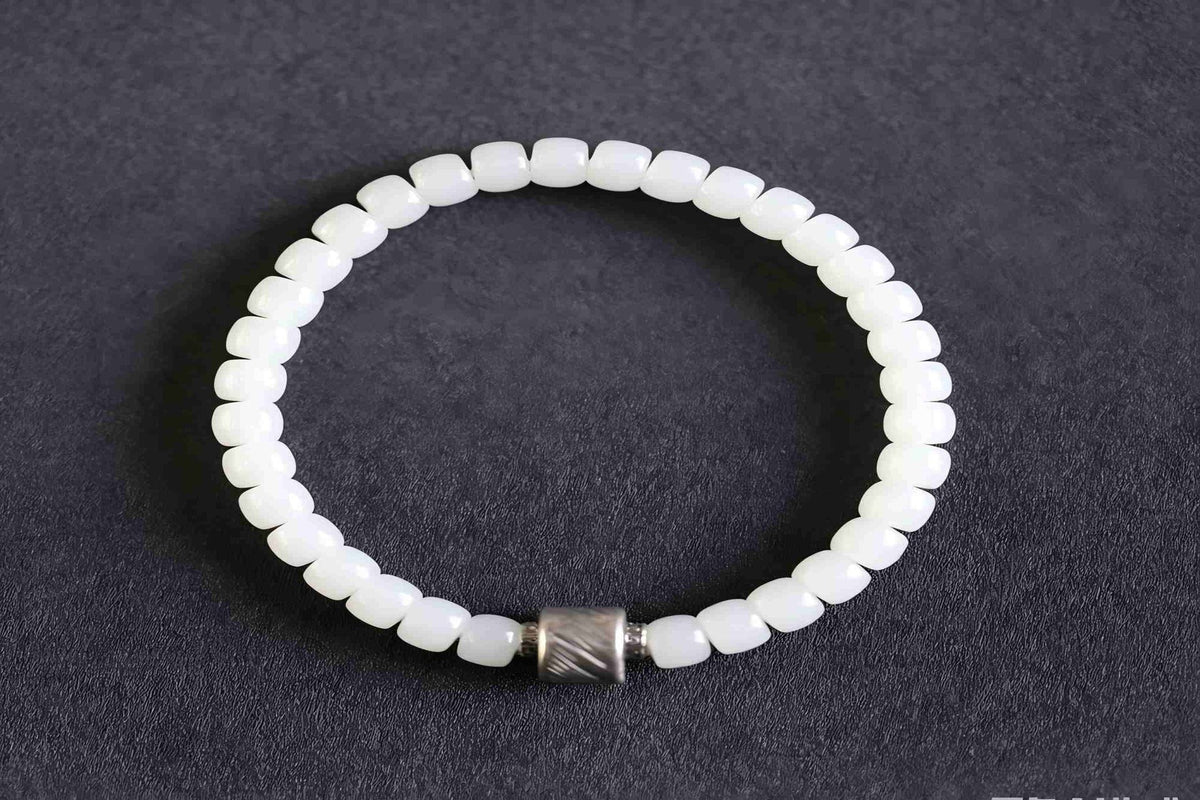 PILLAR Pill 6.7×5 · Suet White 2 — nephrite jade cylinder bracelet, front