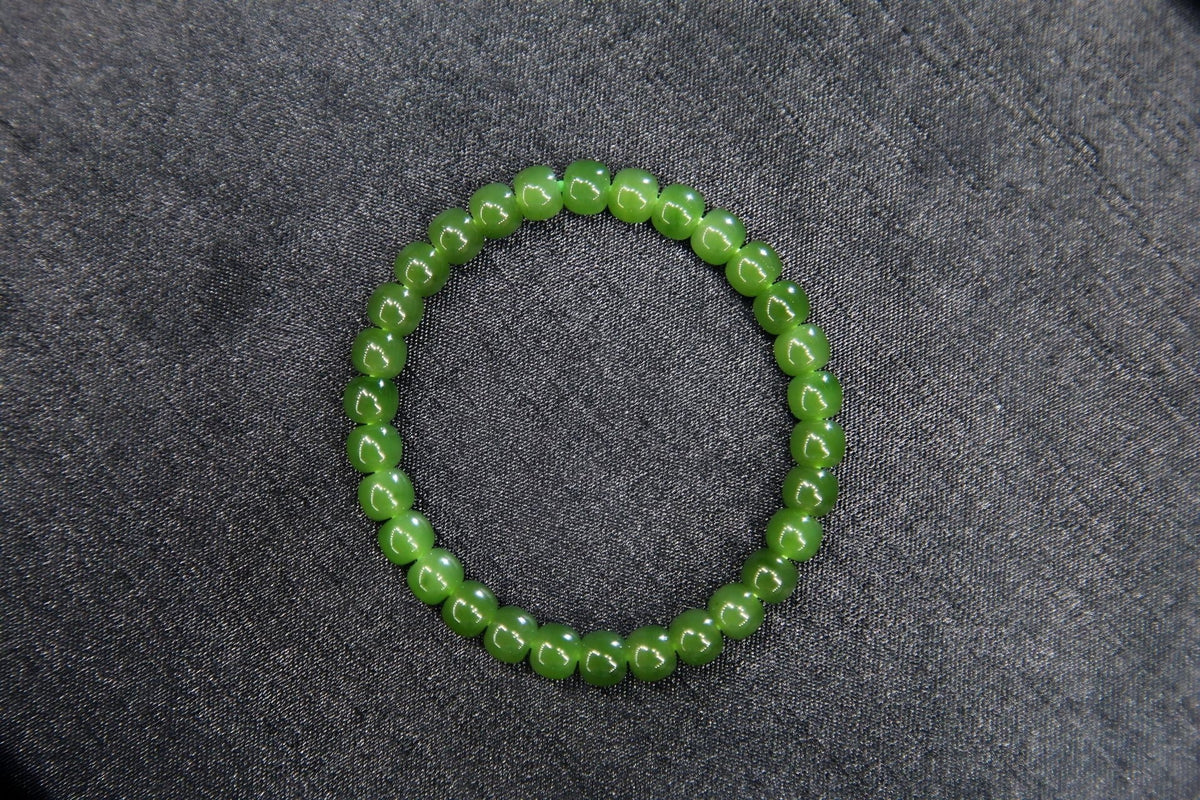 PILLAR Pill 7×6 · Spinach Green — nephrite jade cylinder bracelet, front
