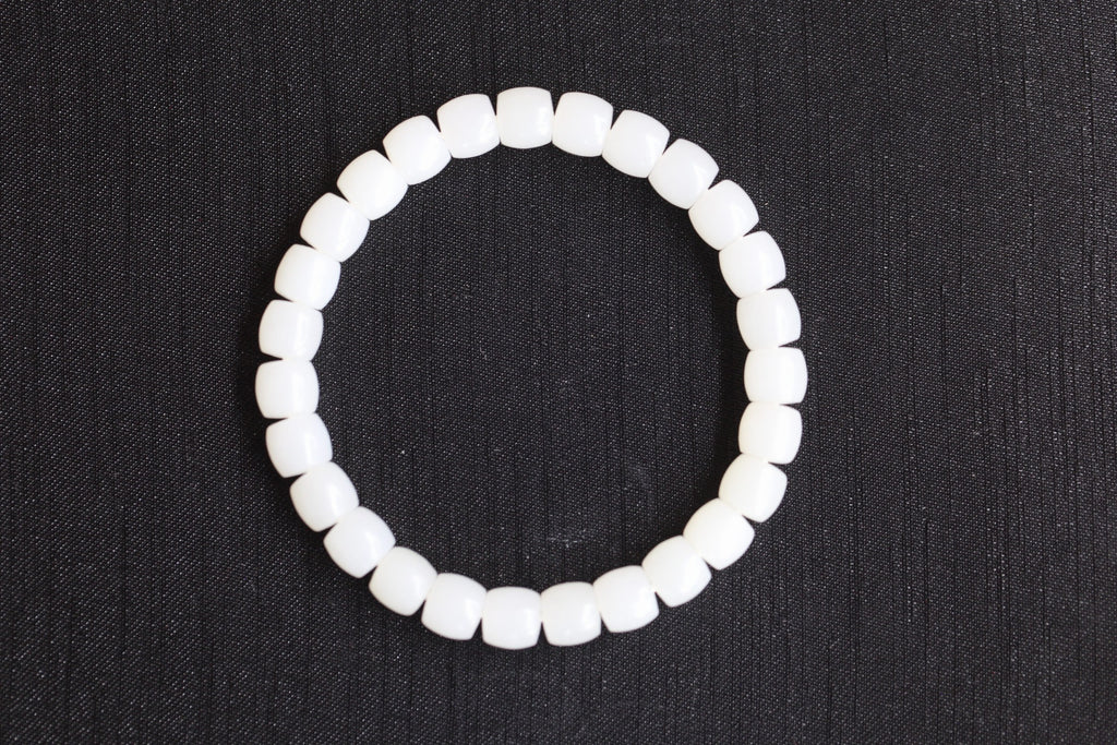 PILLAR Pill 7.8×7.2 · Suet White — nephrite jade cylinder bracelet, front