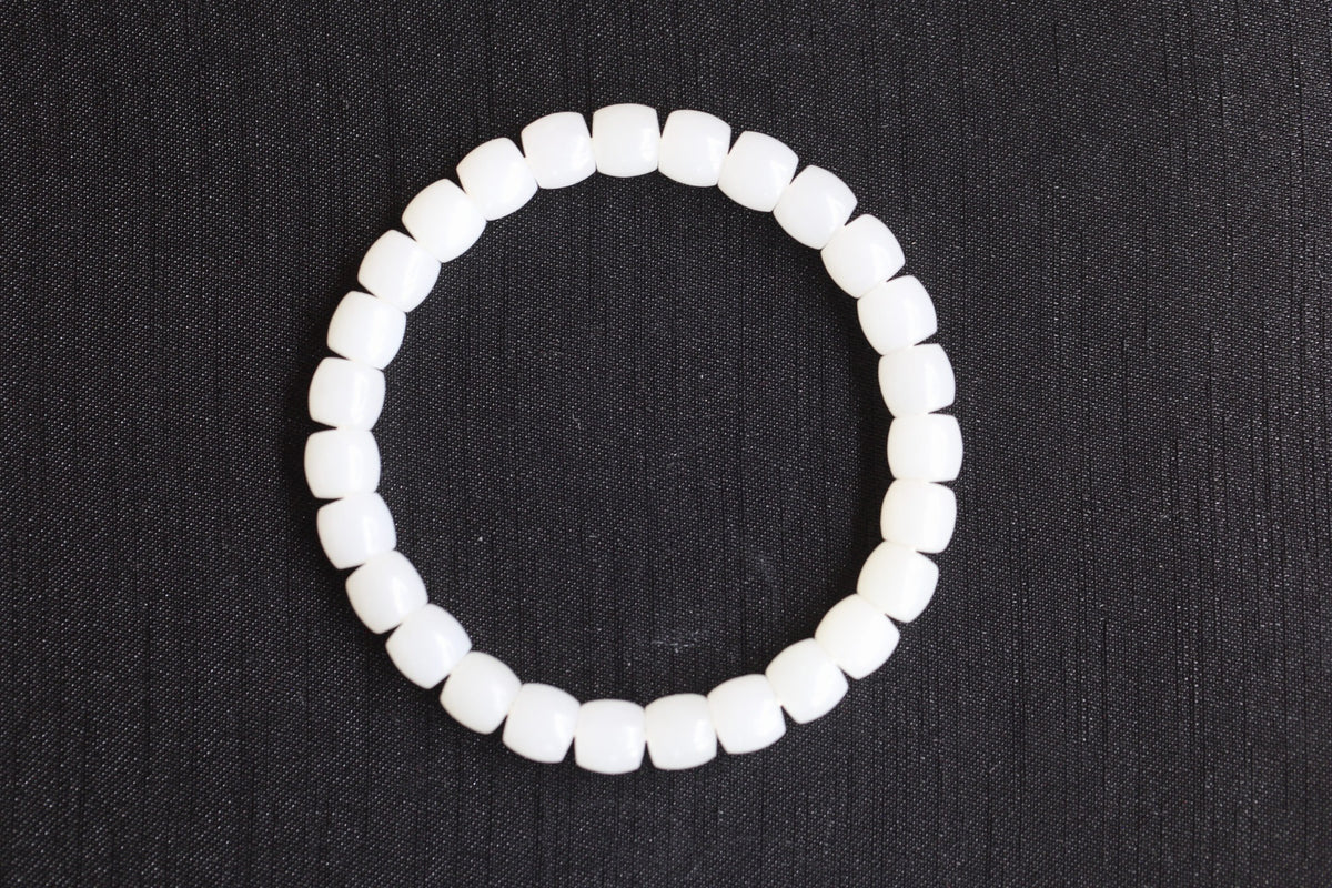 PILLAR Pill 7.8×7.2 · Suet White — nephrite jade cylinder bracelet, front