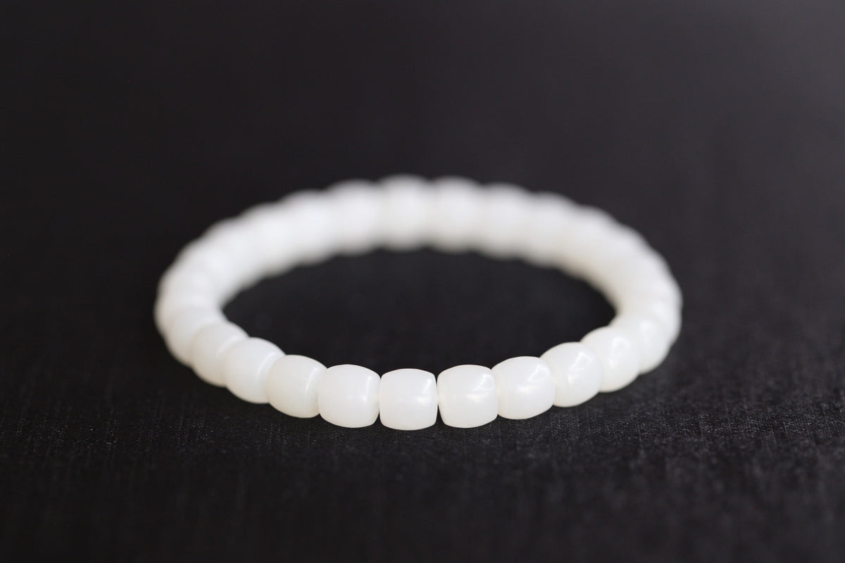PILLAR Pill 7.8×7.2 · Suet White — nephrite jade cylinder bracelet, detail