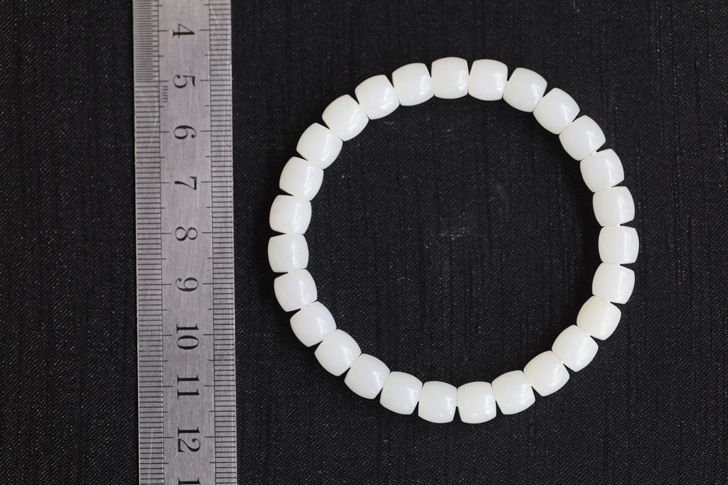 PILLAR Pill 7.8×7.2 · Suet White — nephrite jade cylinder bracelet, size reference